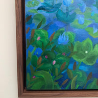 Framed painting of a underwater scene with green plants and blue water.