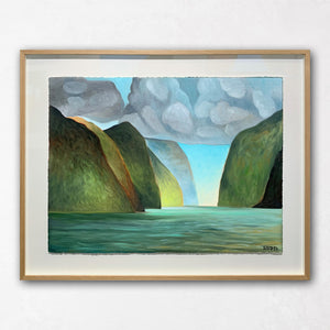 Framed shadow box wall art with islands and clouds